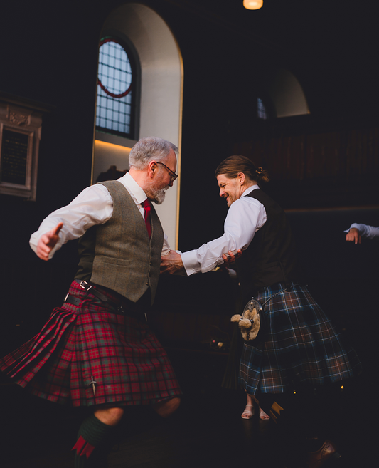 Woman wearing tartan shawl at a Scottish ceilidh