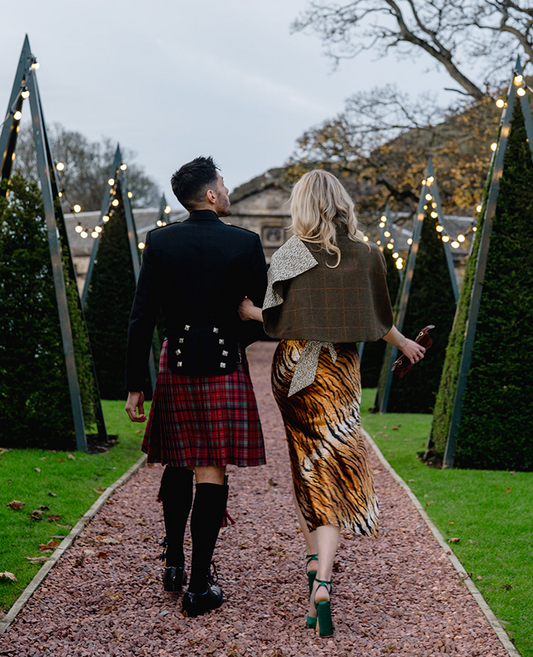 Woman wearing tartan shawl at a Scottish ceilidh